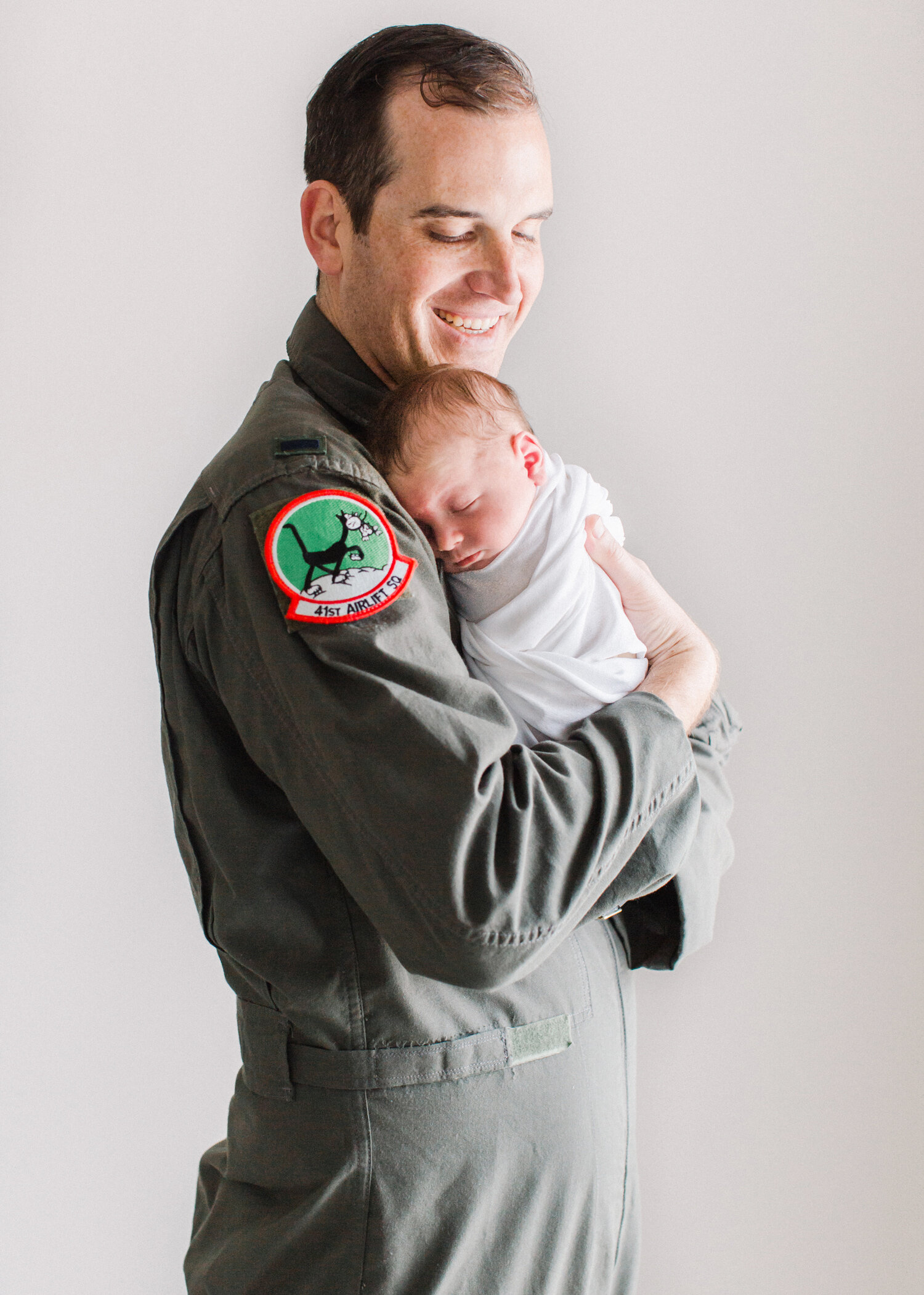 dad-with-newborn-in-military-uniform.jpg