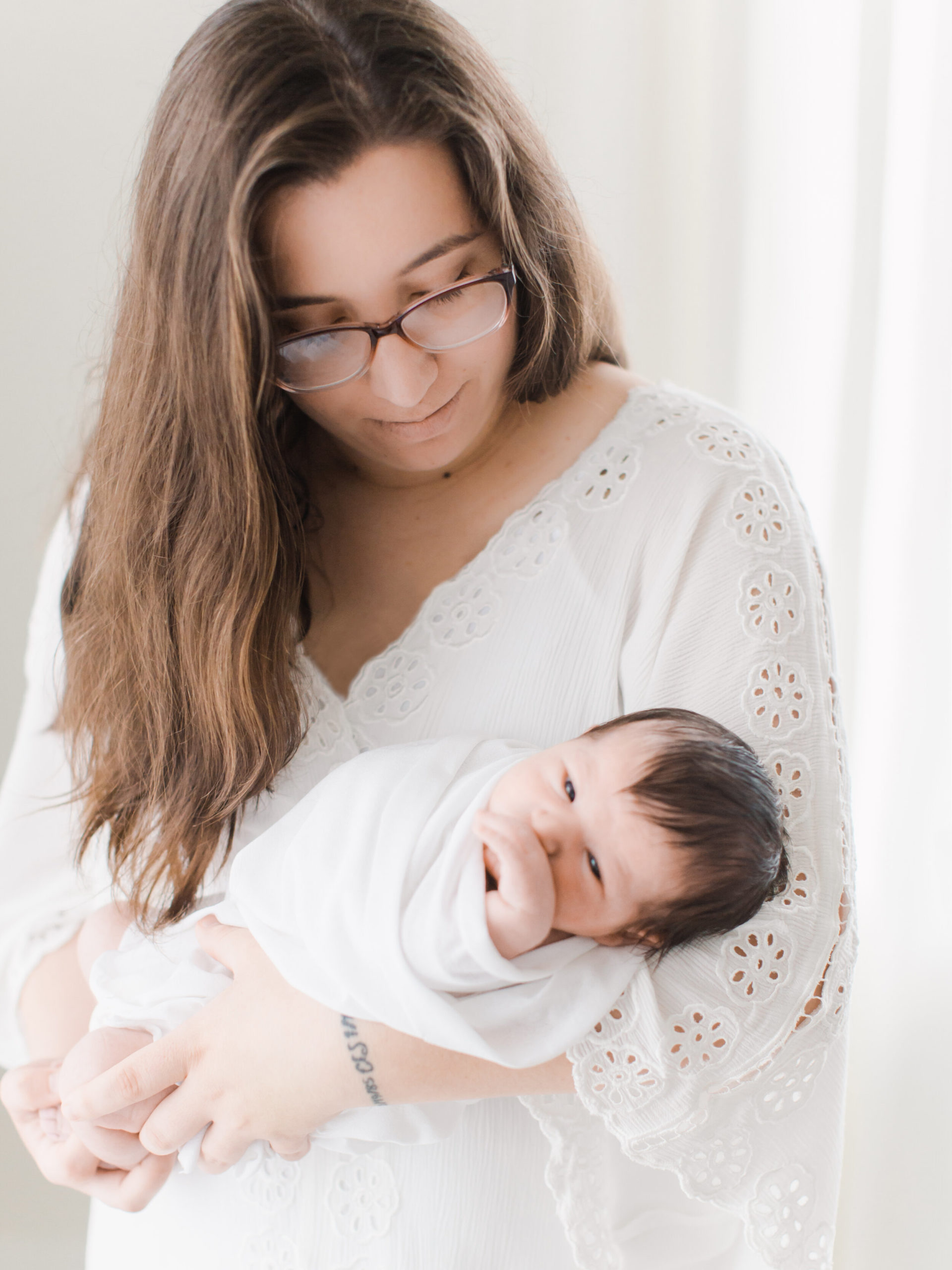 Mom with newborn baby in Bentonville AR photography studio