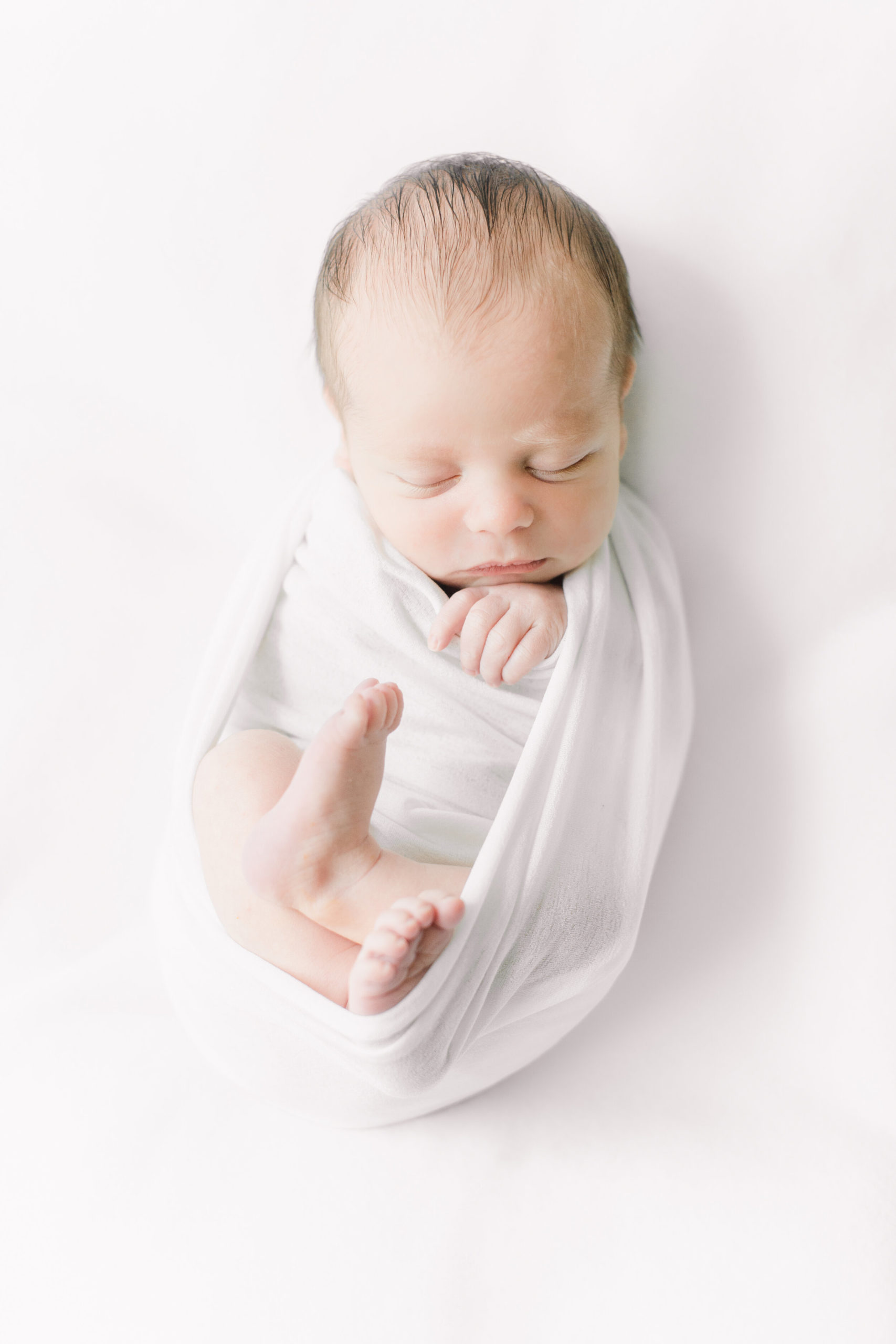 simple all white newborn portrait
