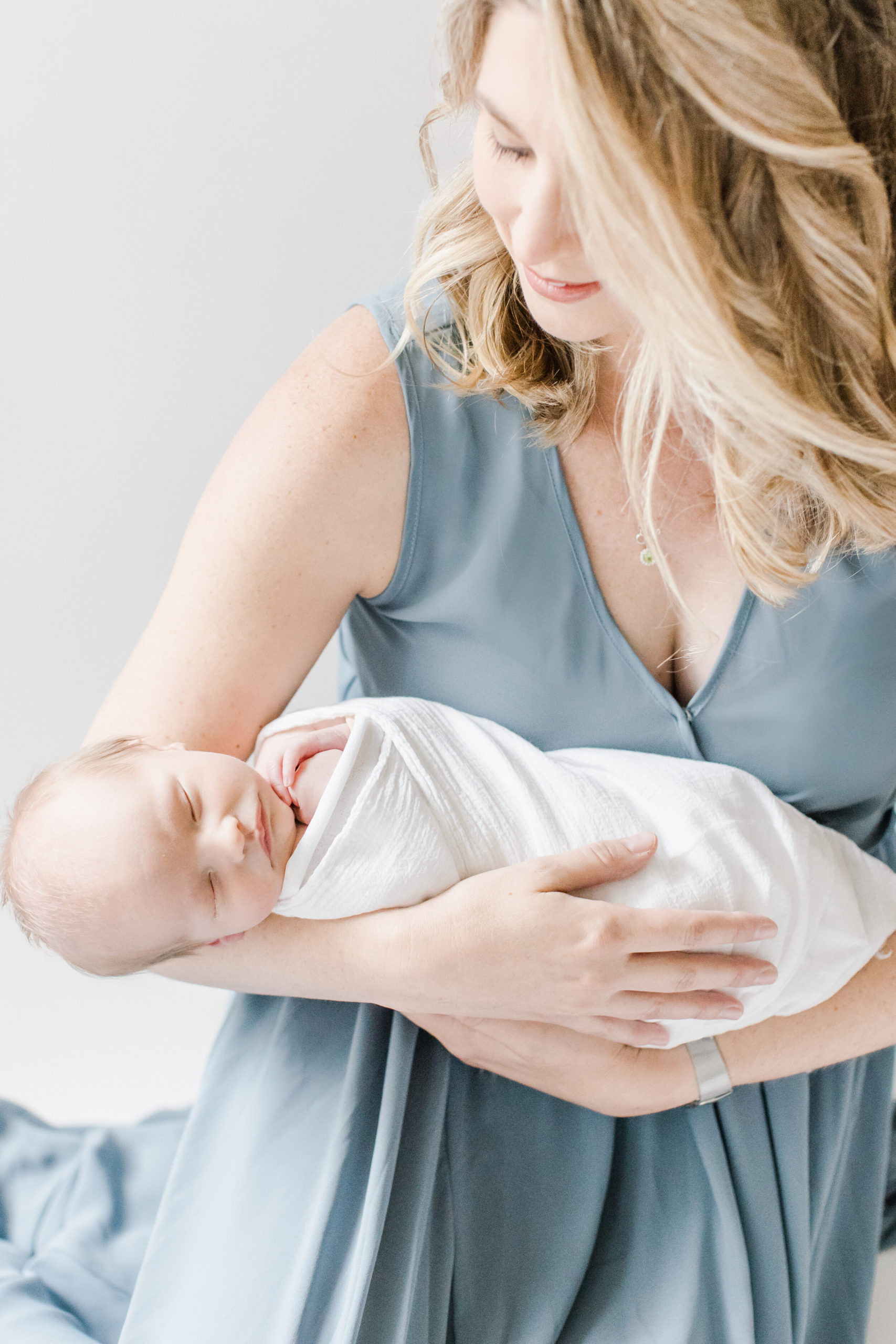 newborn with mom in dusty blue dress