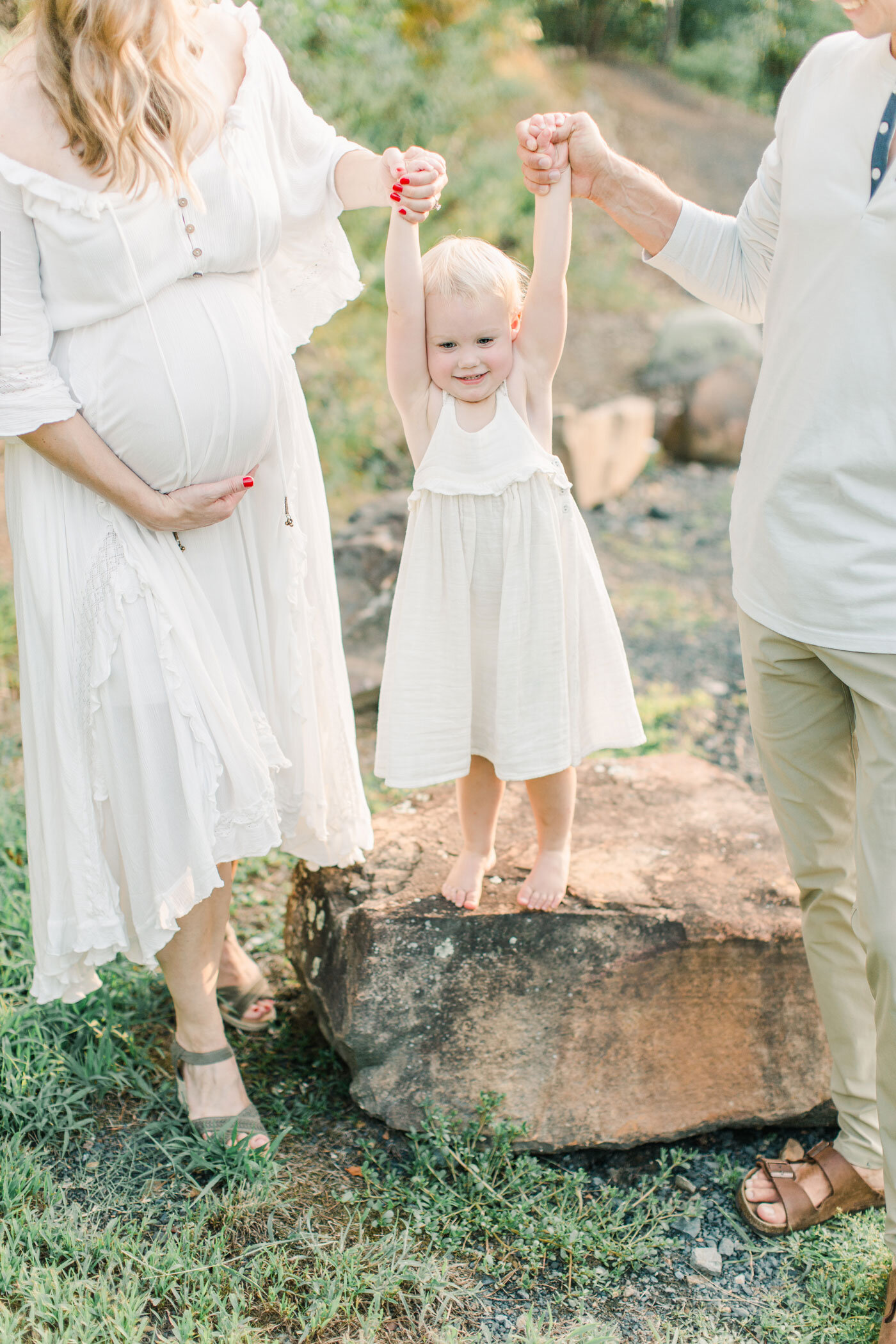 Mom, Dad, and Toddler during Maternity Photos