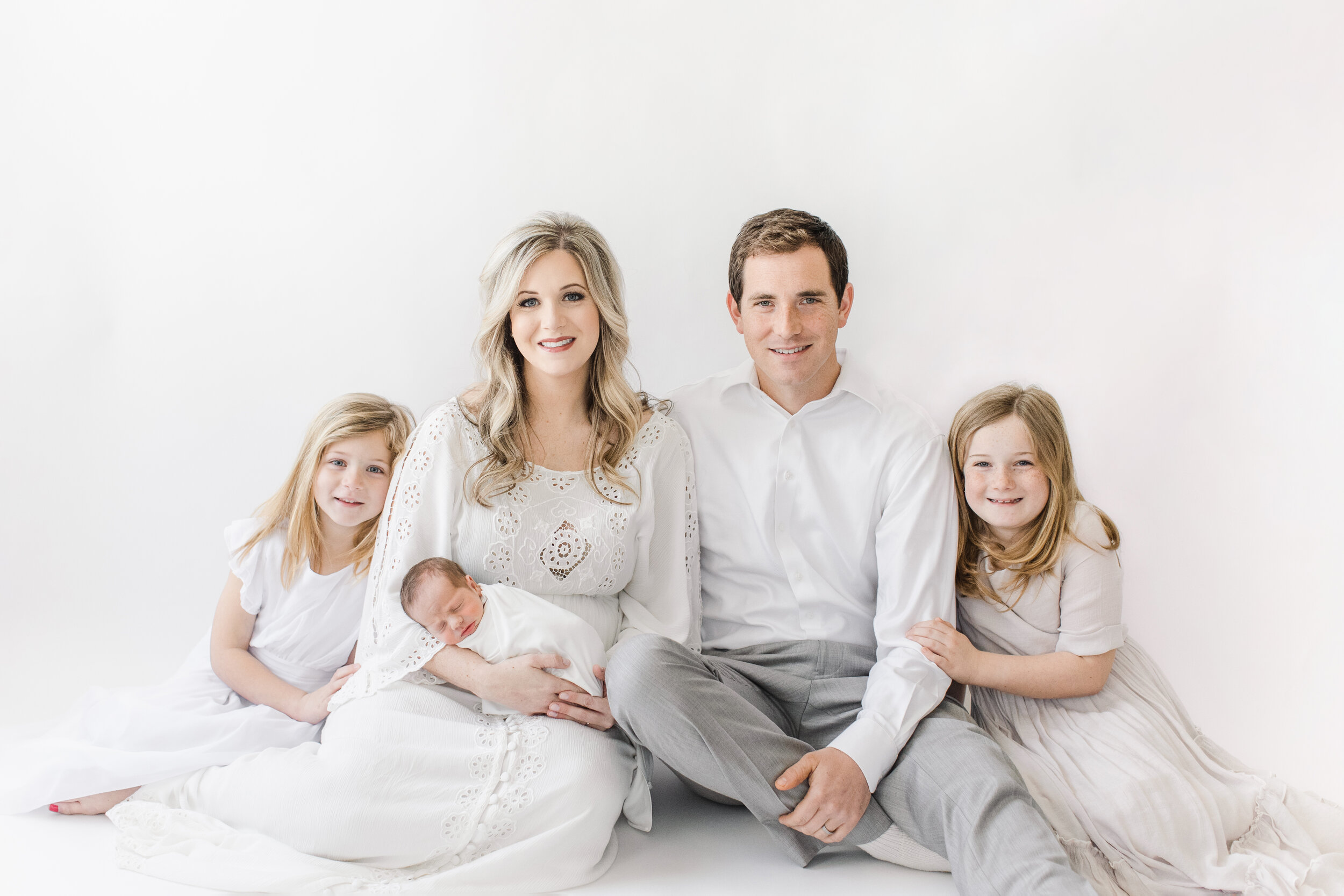 newborn family photo shoot with three kids