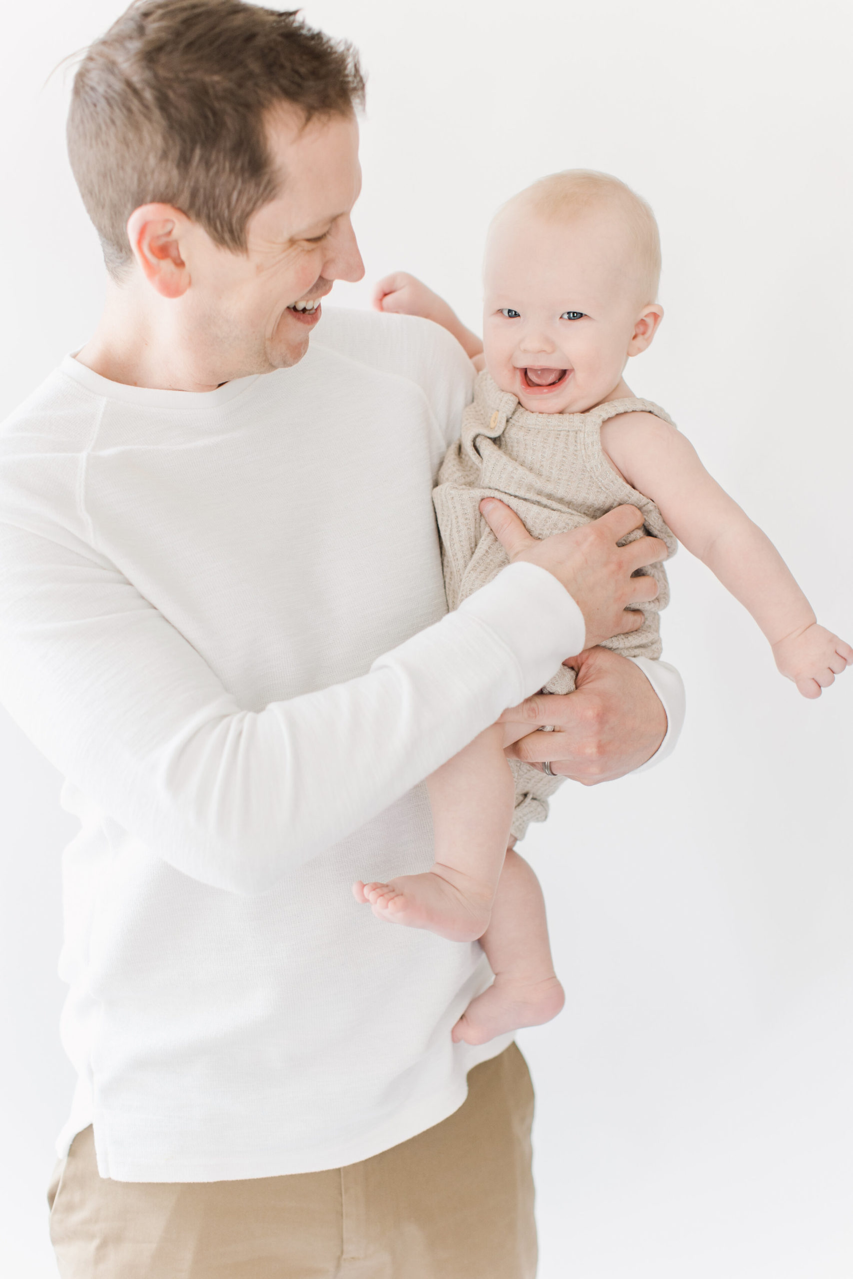 Baby boy with dad during 6 month photo shoot